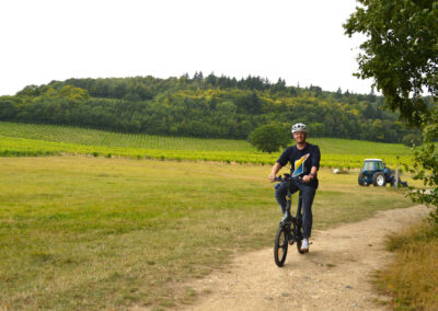 E-bike cycling on Greensands Way at Denbies Wine Estate